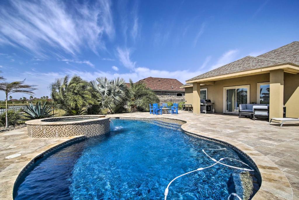 a swimming pool in the backyard of a house at Laguna Vista Resort-Style Home, Private Pool and Spa in Laguna Vista