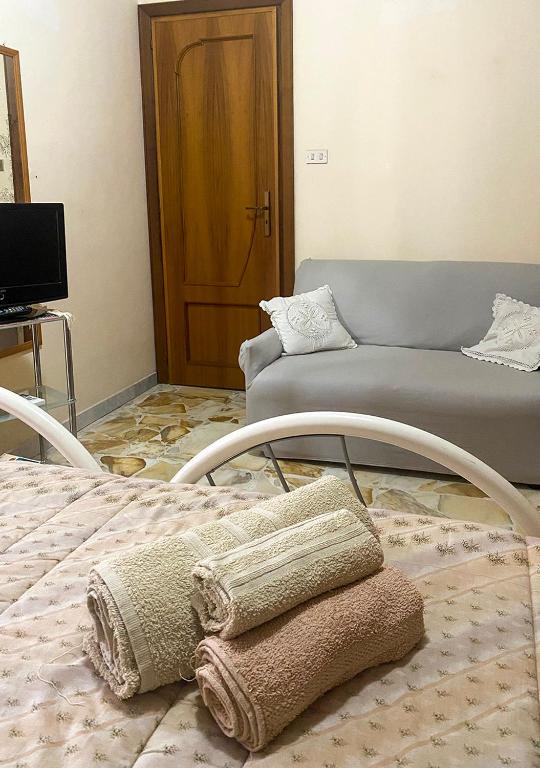 Łóżko lub łóżka w pokoju w obiekcie Casa vacanze Gioia