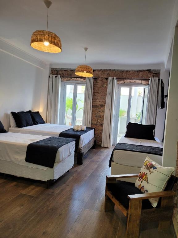 Postel nebo postele na pokoji v ubytování Pelourinho Boutique Hotel - OH HOTÉIS