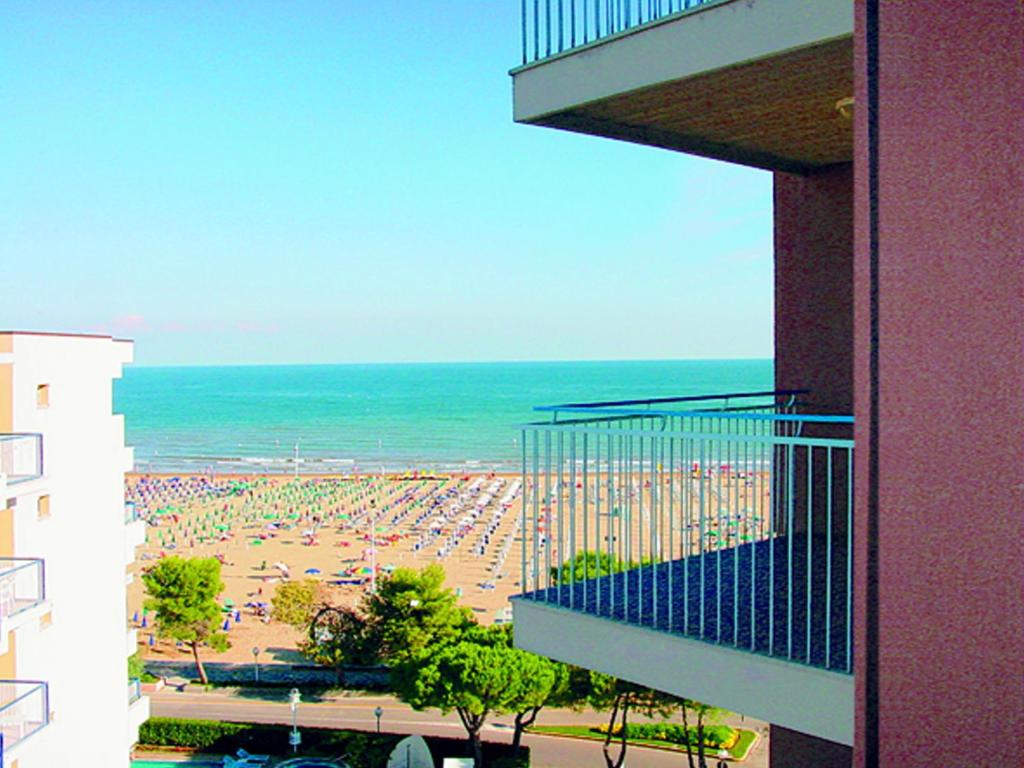 a view of a beach from a balcony of a building at Flat in Lignano Sabbiadoro in Lignano Sabbiadoro