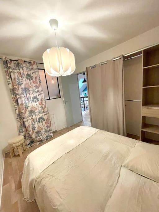 Posteľ alebo postele v izbe v ubytovaní Appartement Cosy Hyper centre WIFI
