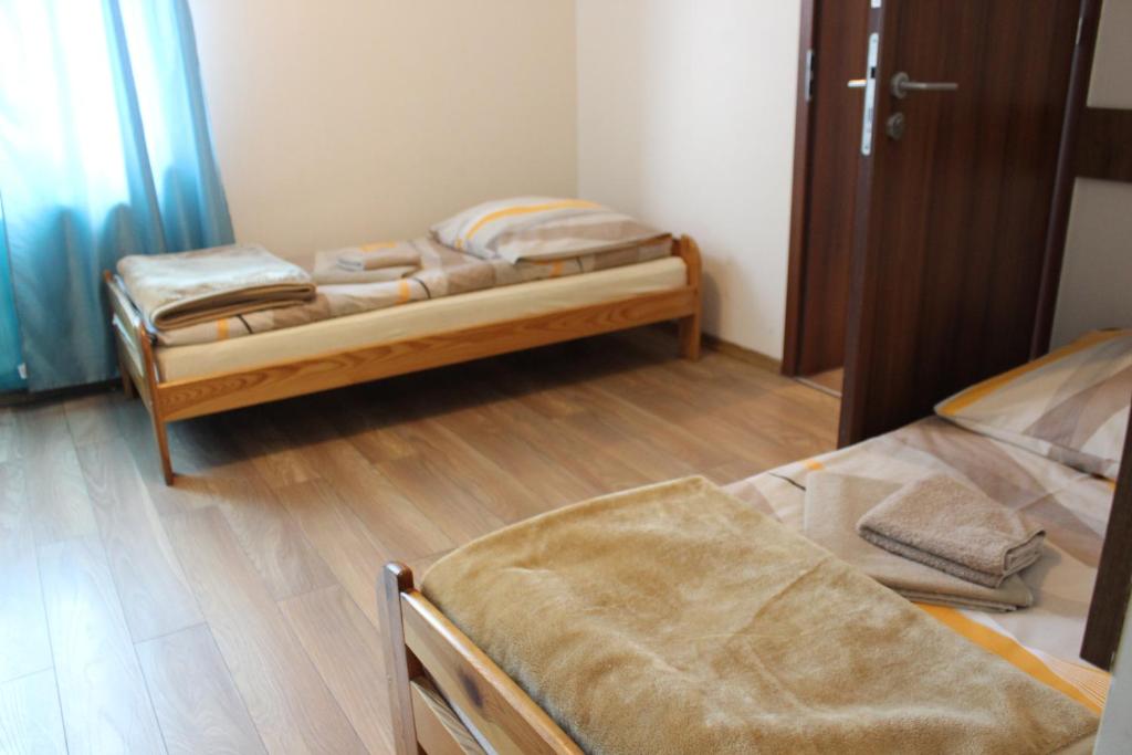 Postel nebo postele na pokoji v ubytování Dom Pielgrzyma