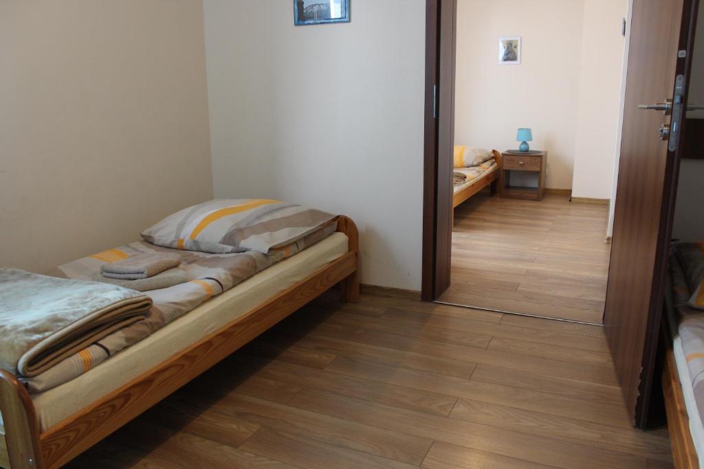 Postel nebo postele na pokoji v ubytování Dom Pielgrzyma