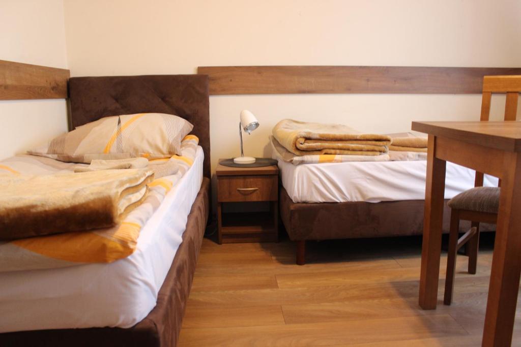 Postel nebo postele na pokoji v ubytování Dom Pielgrzyma