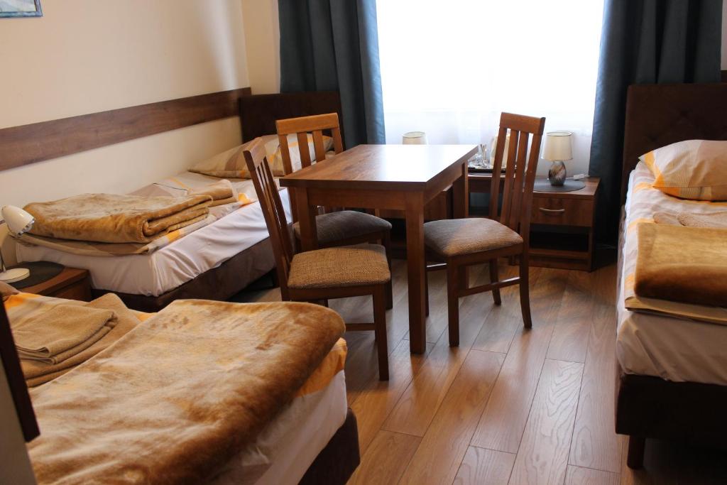 Postel nebo postele na pokoji v ubytování Dom Pielgrzyma