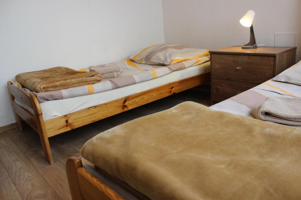 Postel nebo postele na pokoji v ubytování Dom Pielgrzyma
