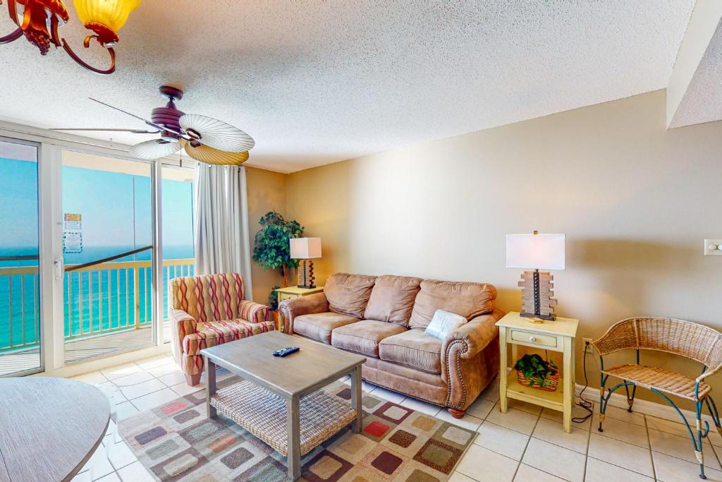 a living room with a couch and a table at Pelican Beach Resort 2003 in Destin