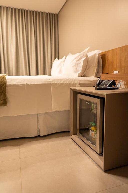 Postel nebo postele na pokoji v ubytování Amazon Aeroporto Hotel