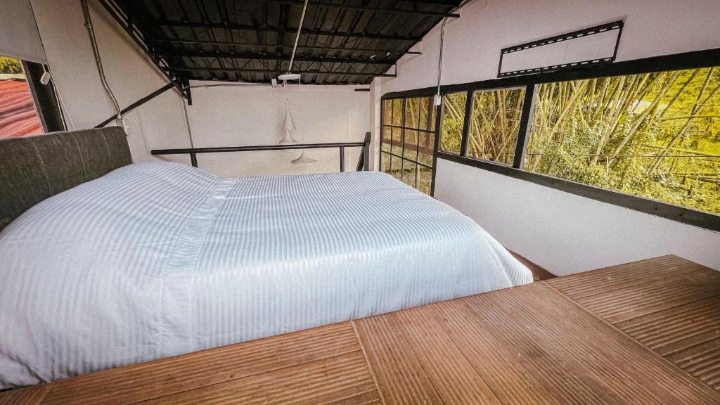 Postel nebo postele na pokoji v ubytování INLOFT Quindío