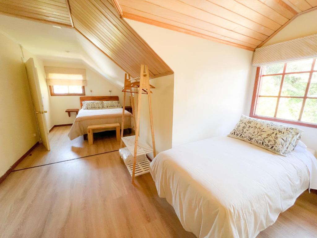 Postel nebo postele na pokoji v ubytování Agua y Campo Hotel Boutique
