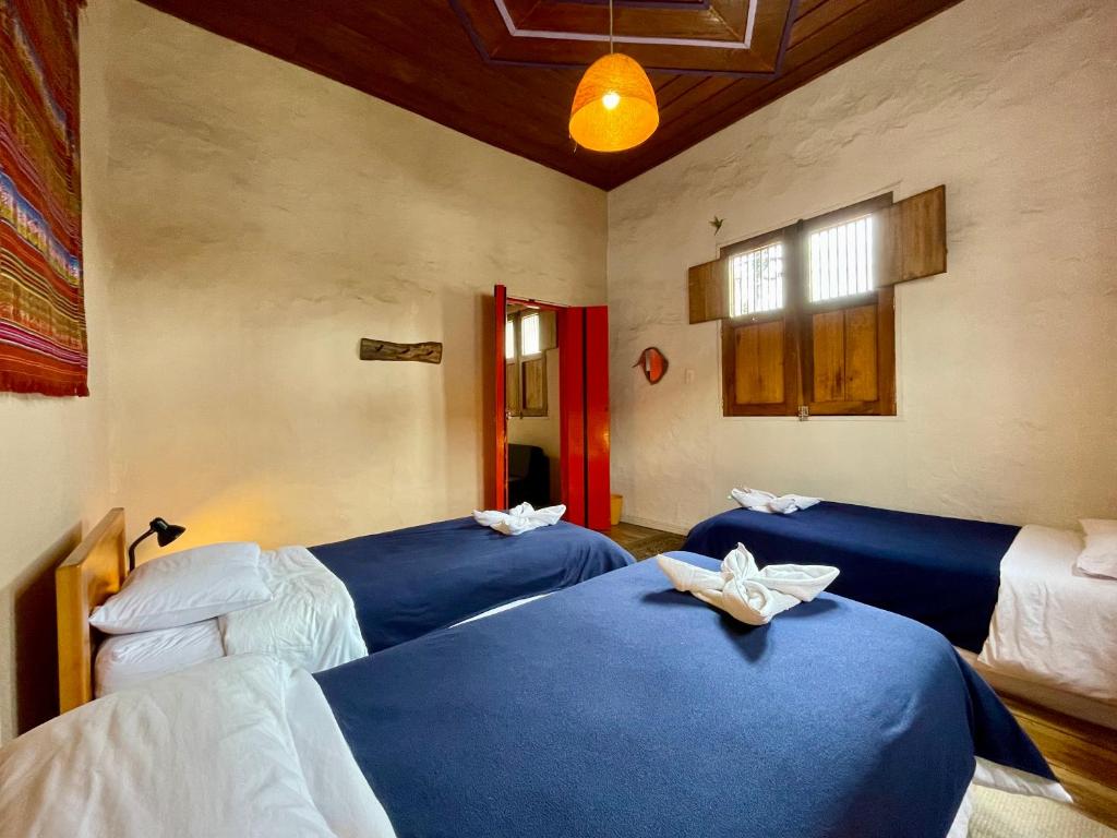 Llit o llits en una habitació de Hostal Tralala Salento