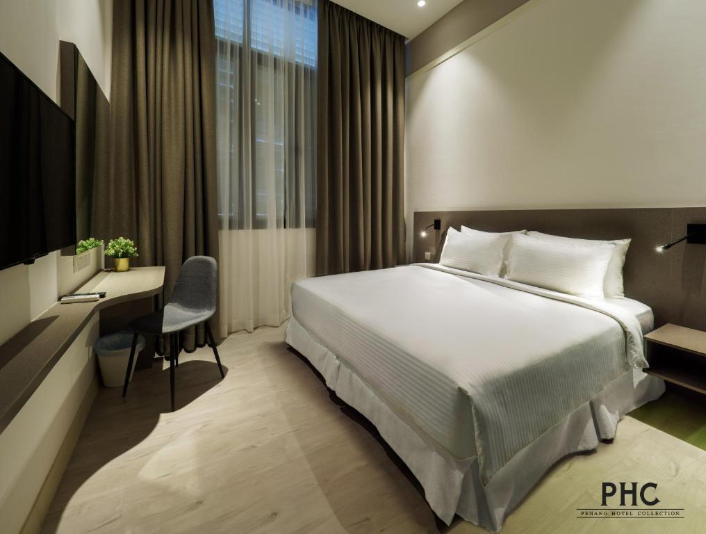 Letto o letti in una camera di Hutton Central Hotel Managed by The Ascott Limited
