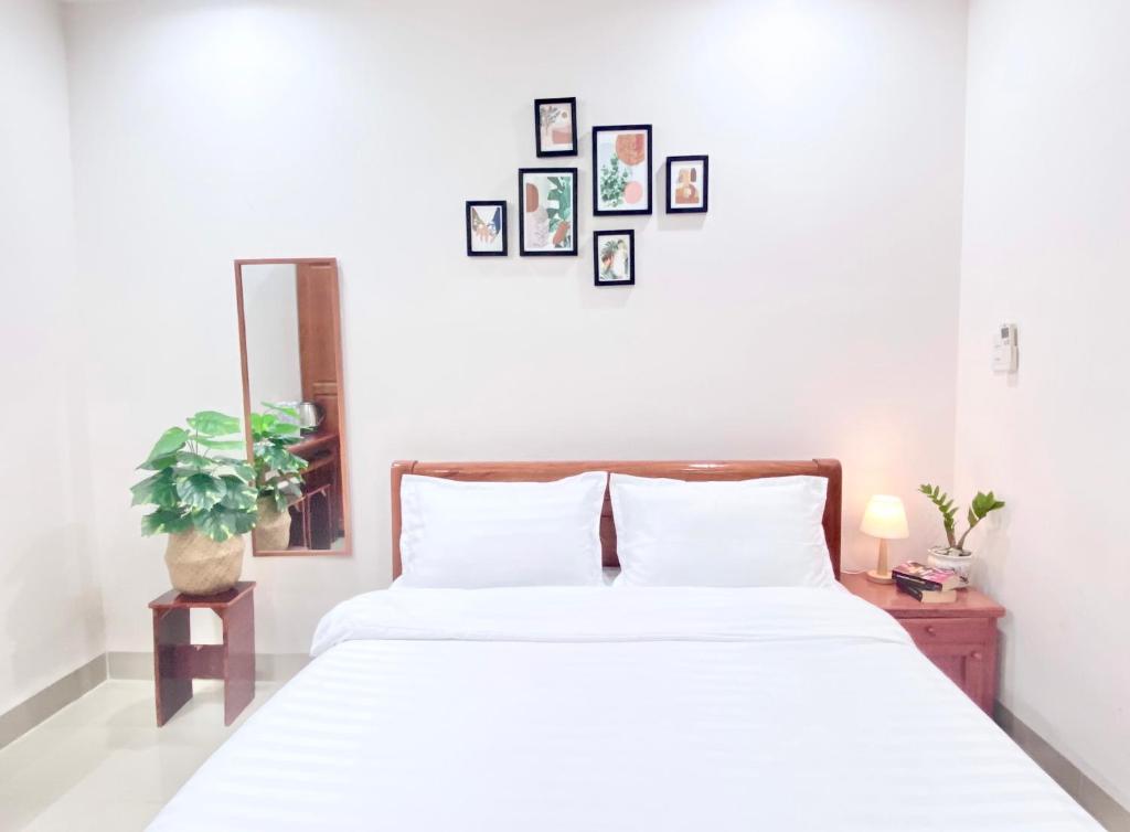 Postel nebo postele na pokoji v ubytování Shiny Homestay Da Nang