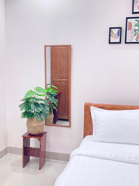 Postel nebo postele na pokoji v ubytování Shiny Homestay Da Nang