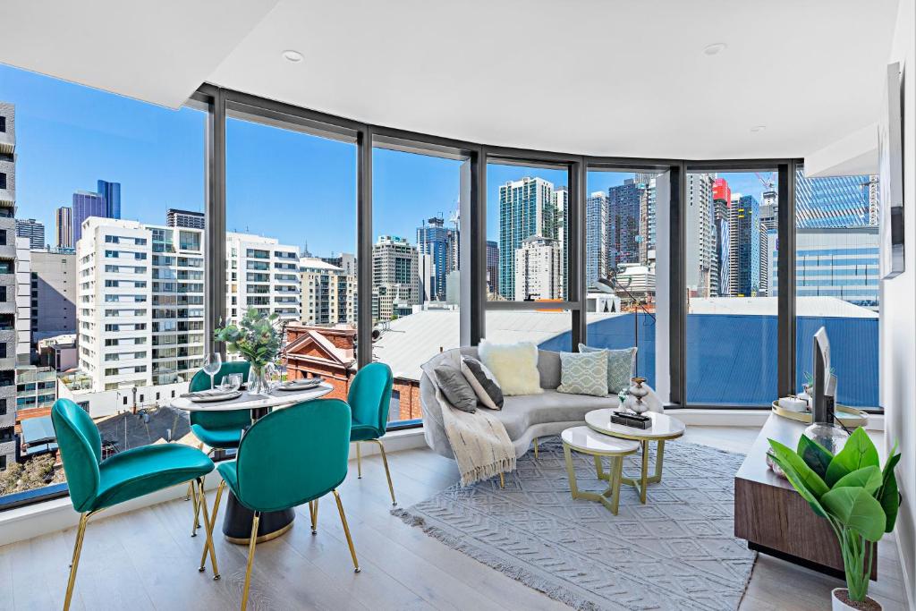 a living room with a view of a city at Lumina Suites in Melbourne