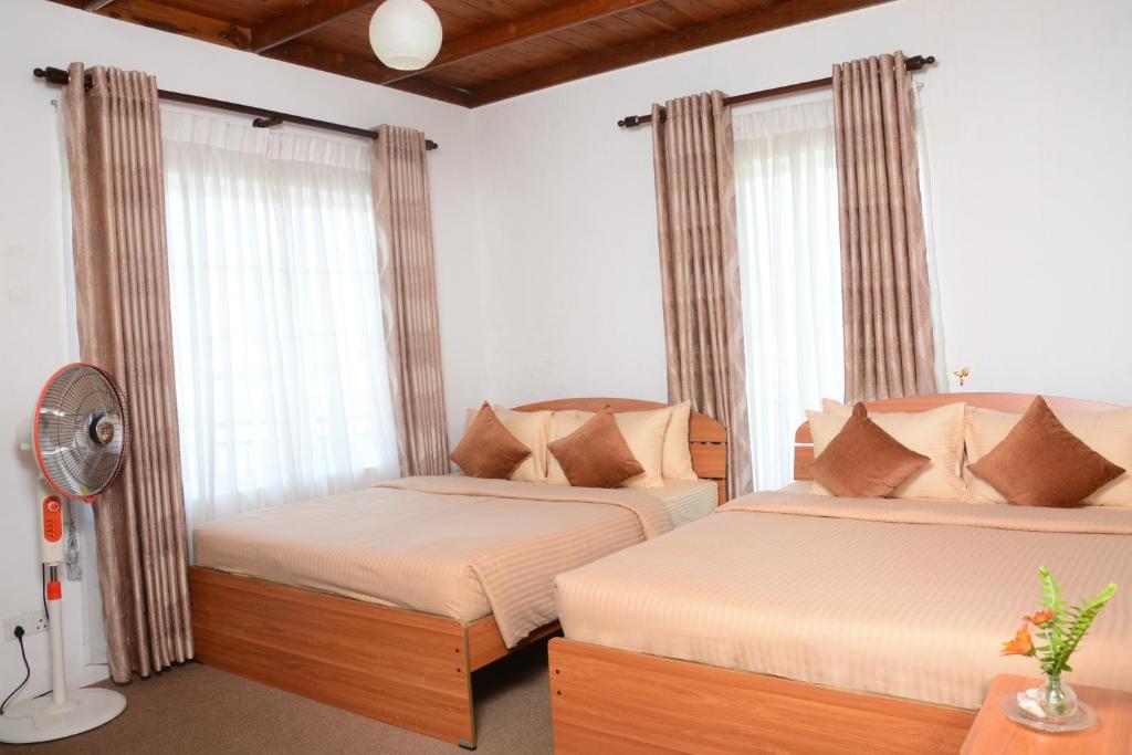Postel nebo postele na pokoji v ubytování The Fern Inn