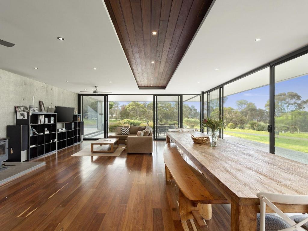a large living room with a large wooden table at Cypress Hill in Apollo Bay