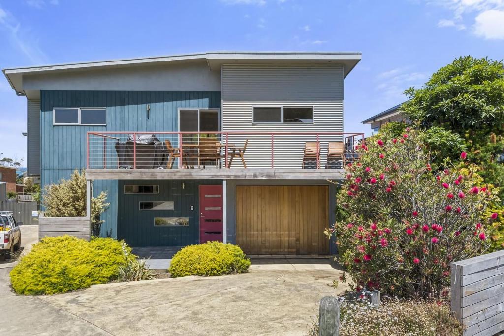 a house with a balcony on top of it at Poseidon in Apollo Bay