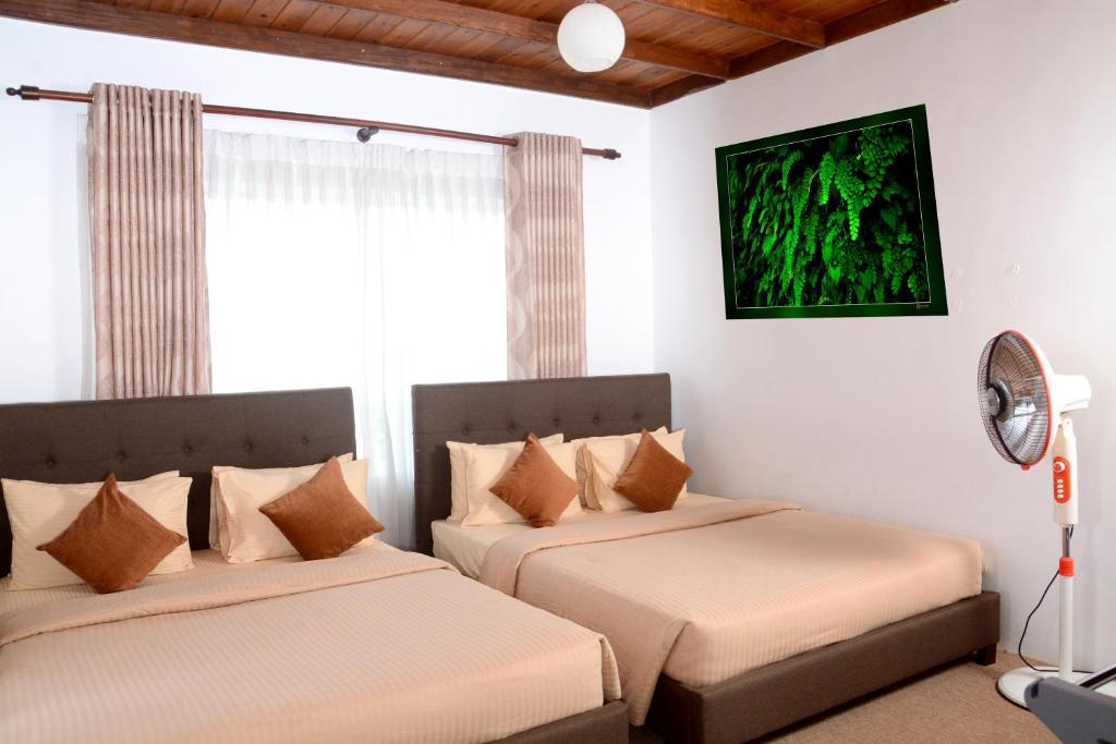Postel nebo postele na pokoji v ubytování The Fern Inn