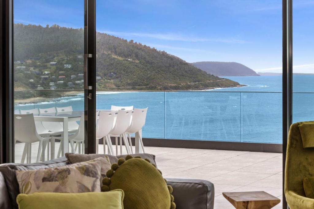 a living room with a view of the ocean at Cape Wye in Wye River