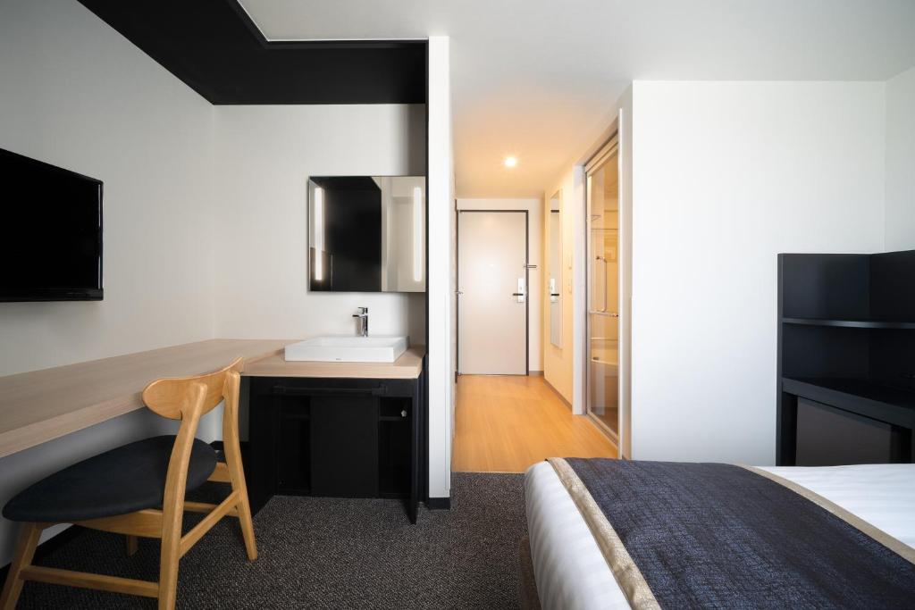 Postel nebo postele na pokoji v ubytování Hotel Vista Hiroshima