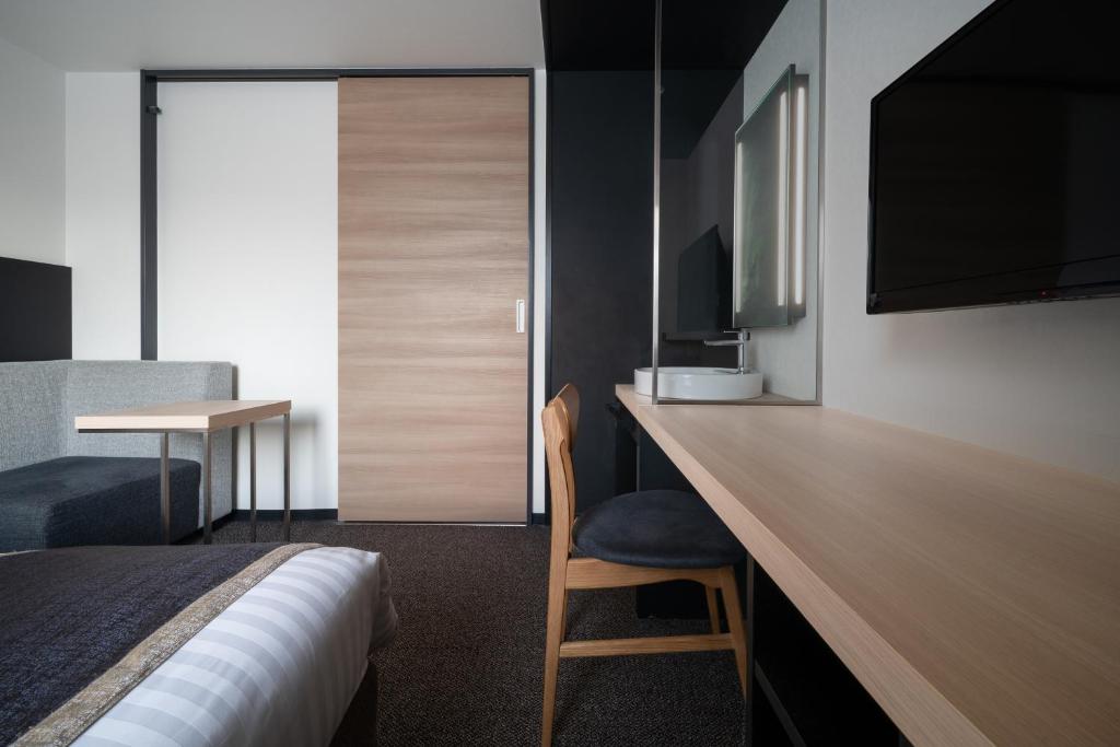 TV a/nebo společenská místnost v ubytování Hotel Vista Hiroshima