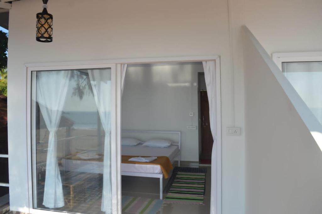 Postel nebo postele na pokoji v ubytování Baywatch Beach Resort patnem