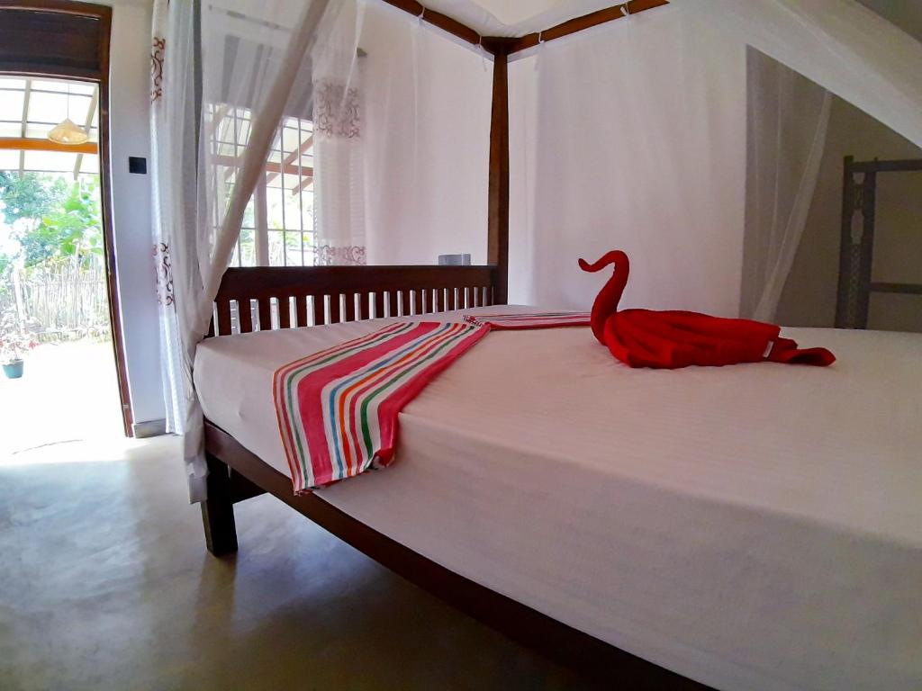 Postel nebo postele na pokoji v ubytování Cashew Villa Hiriketiya