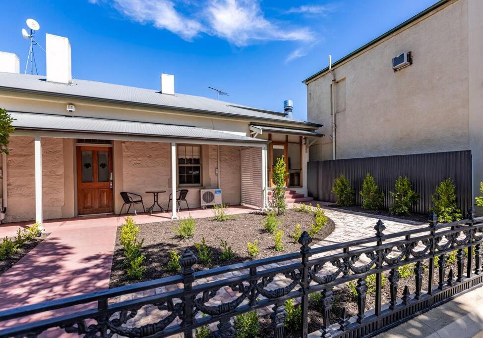 a house with a fence in front of it at Tanunda Central Cottage in Tanunda