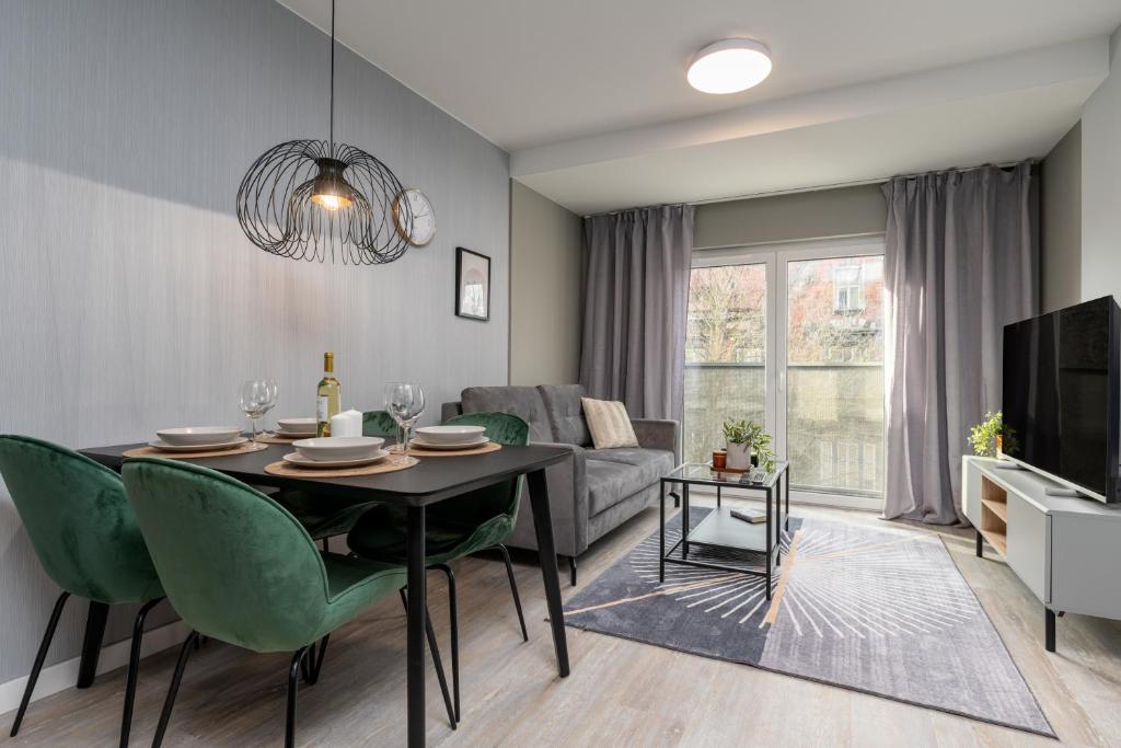 Televízia a/alebo spoločenská miestnosť v ubytovaní CityCenterApartments-11/19