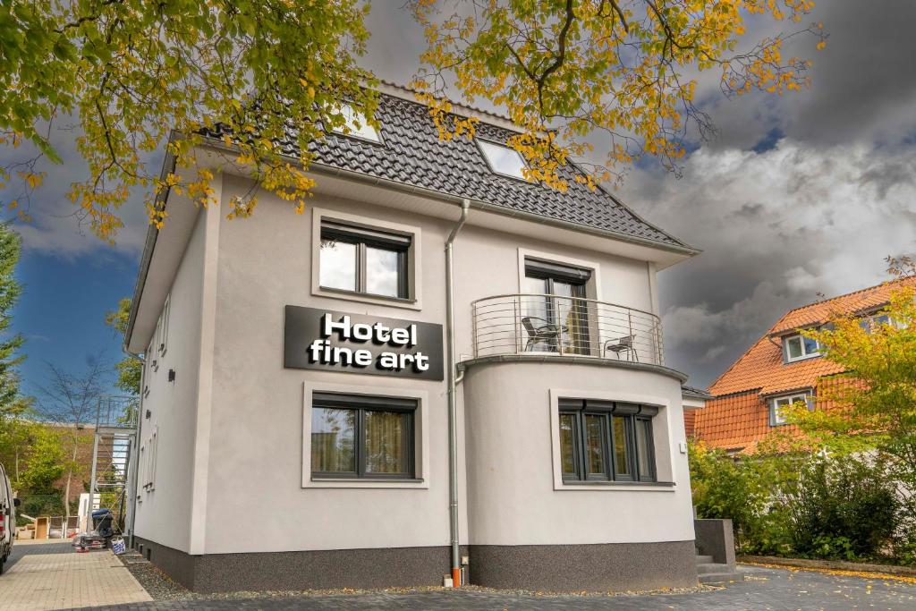 a building with a sign that reads hotel three arts at Hotel fine art in Rotenburg an der Wümme