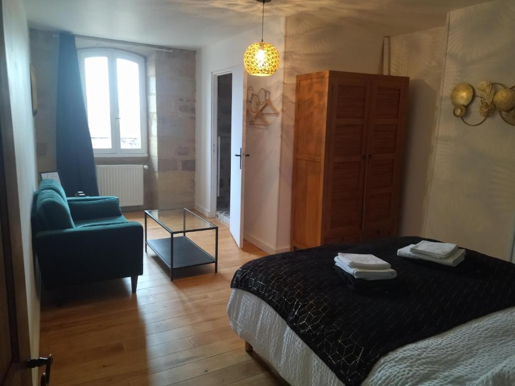Postel nebo postele na pokoji v ubytování Le Pressoir chambres d'hôtes