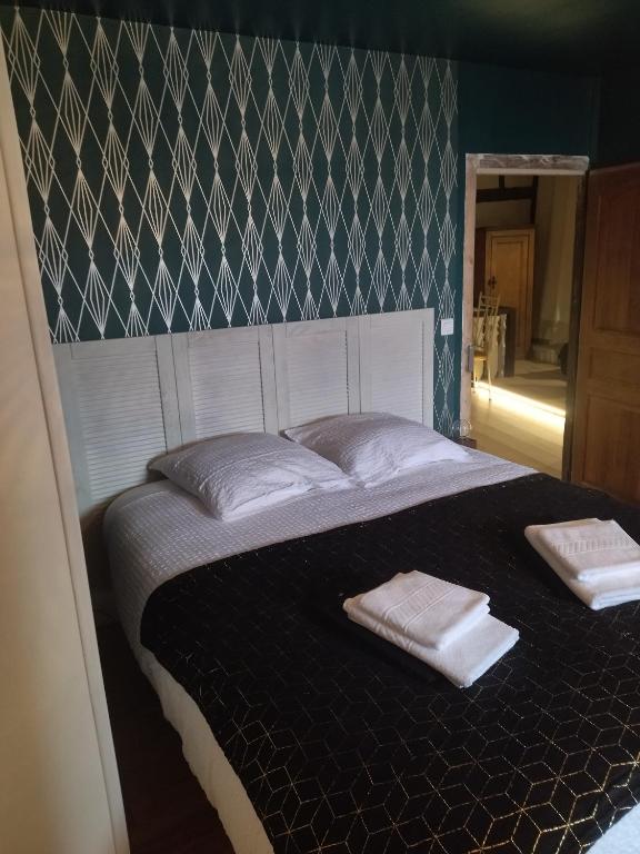 Postel nebo postele na pokoji v ubytování Le Pressoir chambres d'hôtes