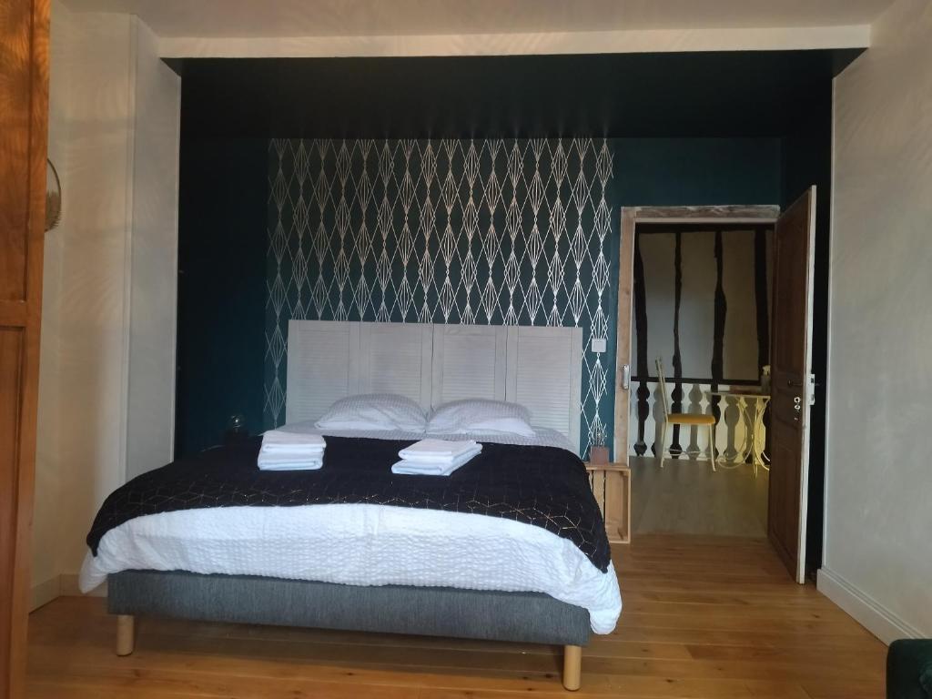 Postel nebo postele na pokoji v ubytování Le Pressoir chambres d'hôtes