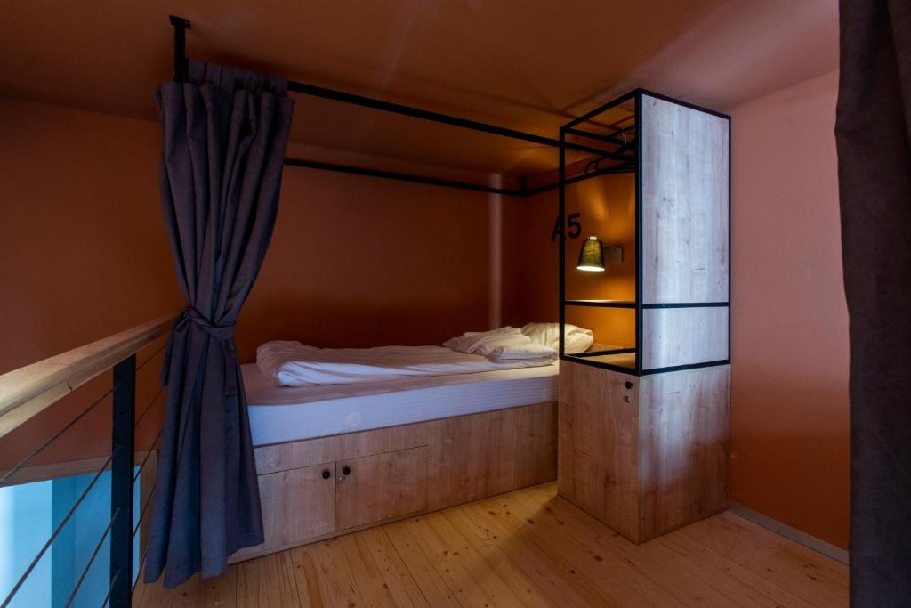 Postel nebo postele na pokoji v ubytování Khada Hostel