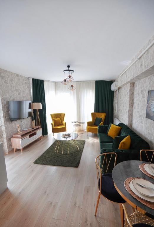 a living room with a couch and a table at King Suite BH37 in Istanbul