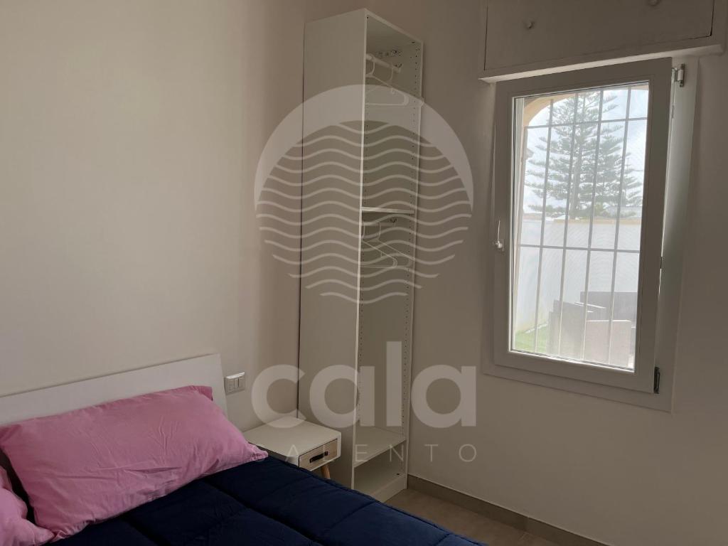 A bed or beds in a room at Villa Alysa - spiaggia a 400m By Cala Salento