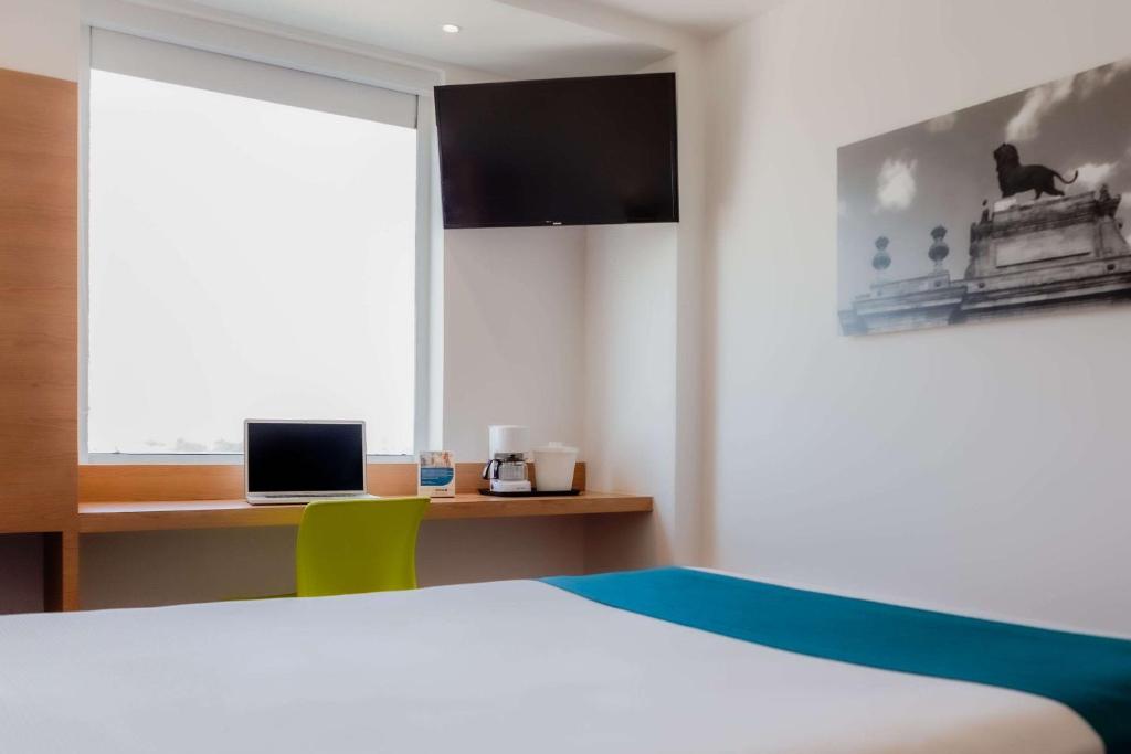 TV a/nebo společenská místnost v ubytování Sleep Inn Leon Antares