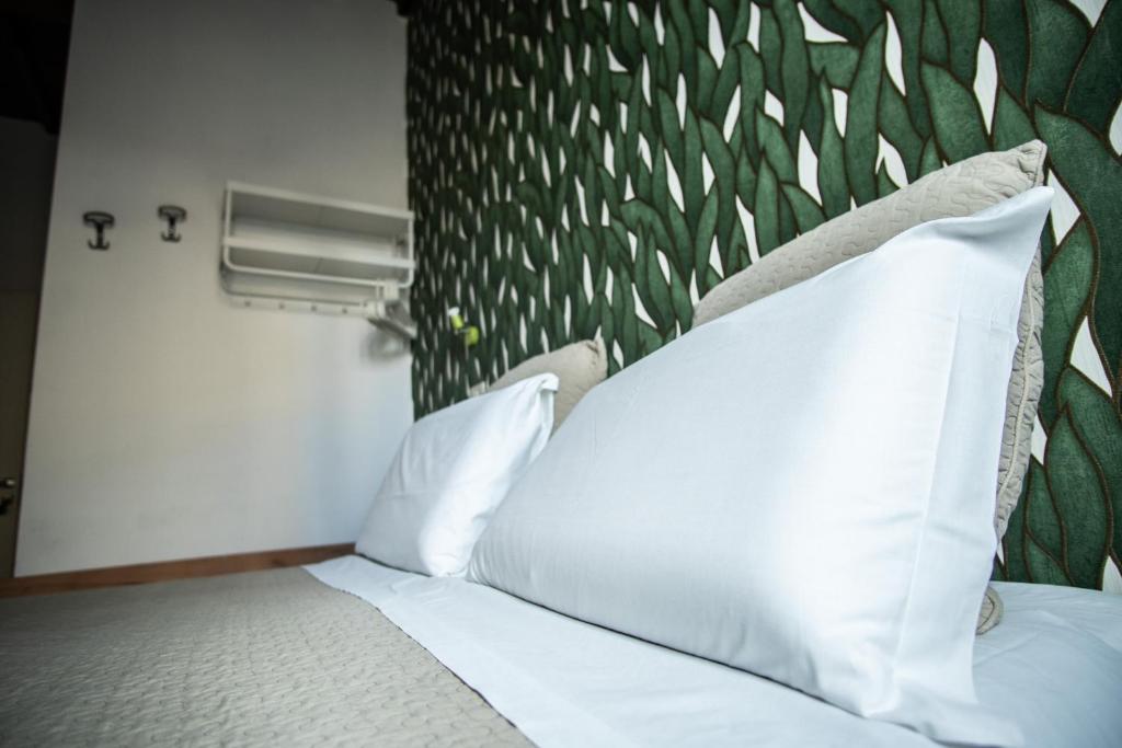 Postel nebo postele na pokoji v ubytování Hotel Nella