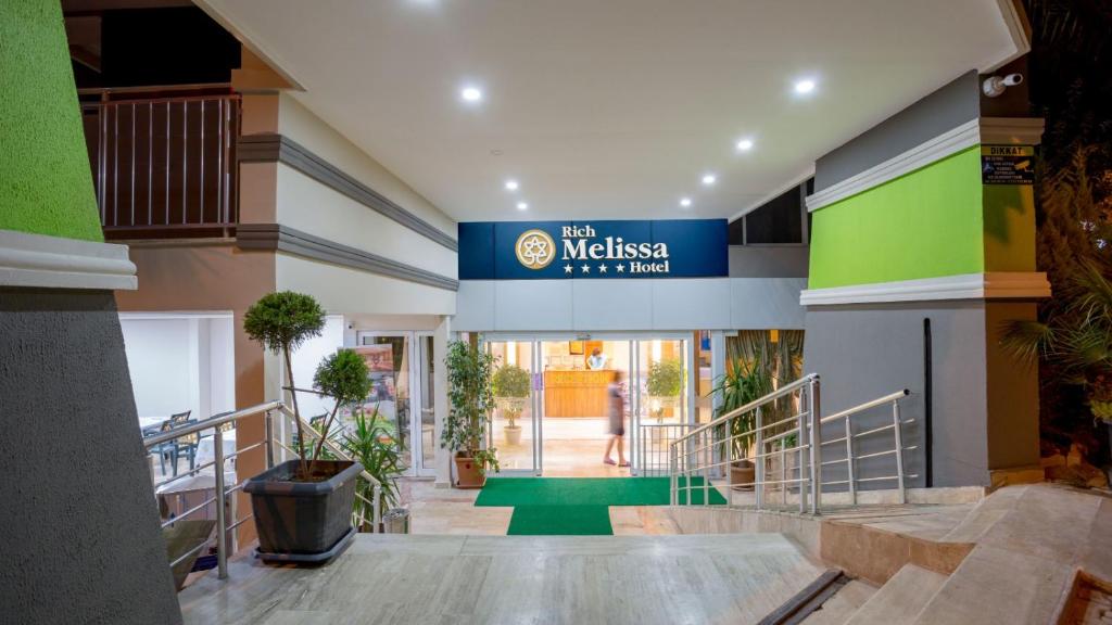 a lobby with a sign that reads the museum in a mall at Rich Melissa Hotel in Kemer