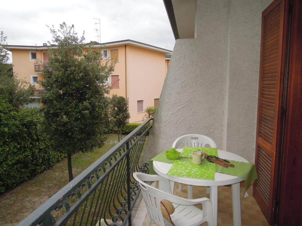 A balcony or terrace at Villa with garden and barbeque 250m from the sea