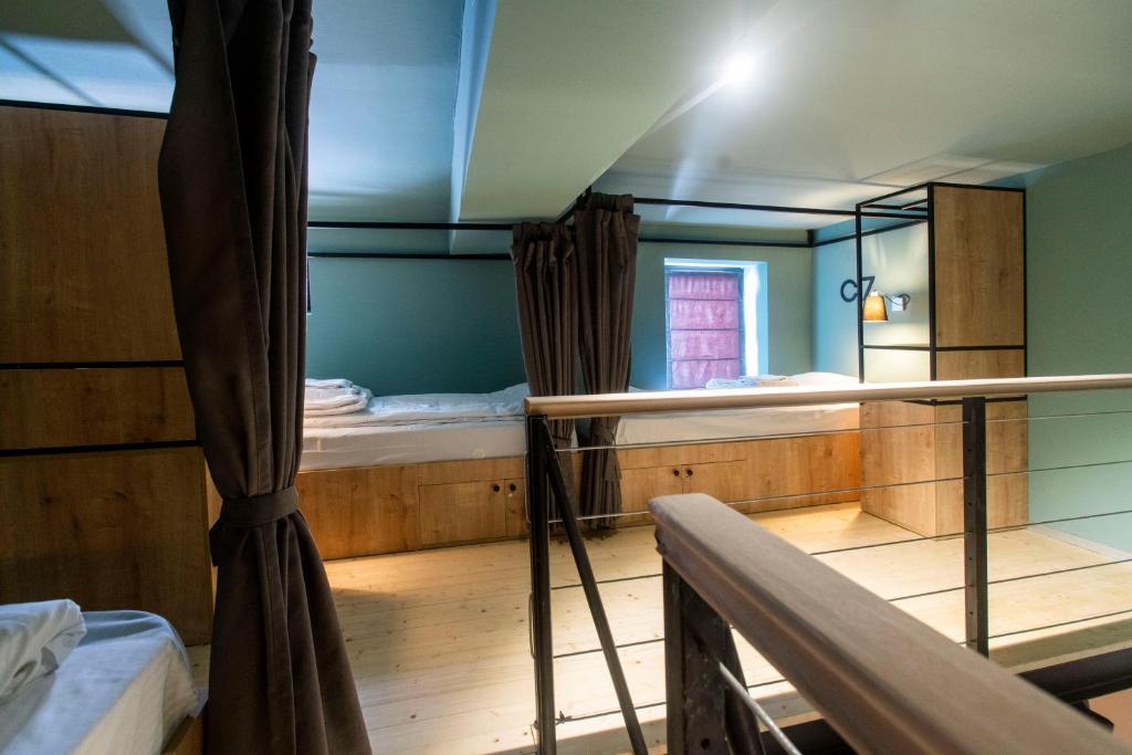 Postel nebo postele na pokoji v ubytování Khada Hostel