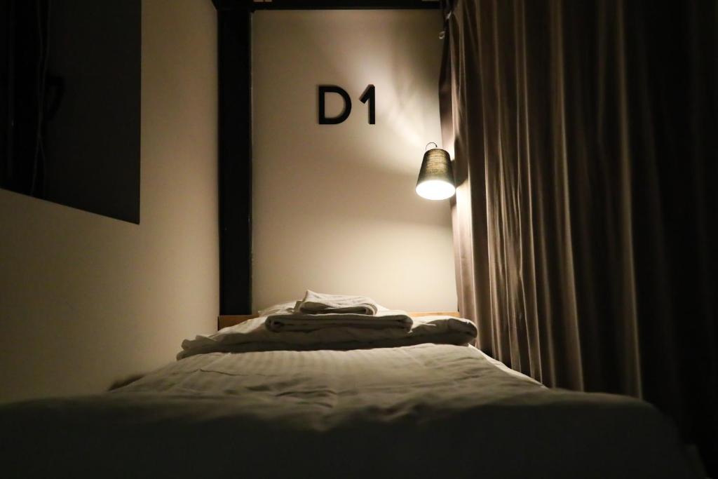 Postel nebo postele na pokoji v ubytování Khada Hostel