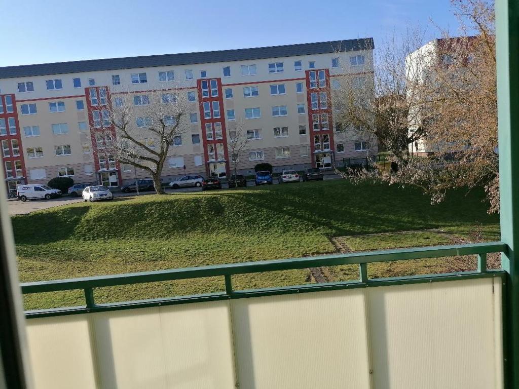 a view of a large building from a window at Mühlhausen Am Schadeberg in Mühlhausen