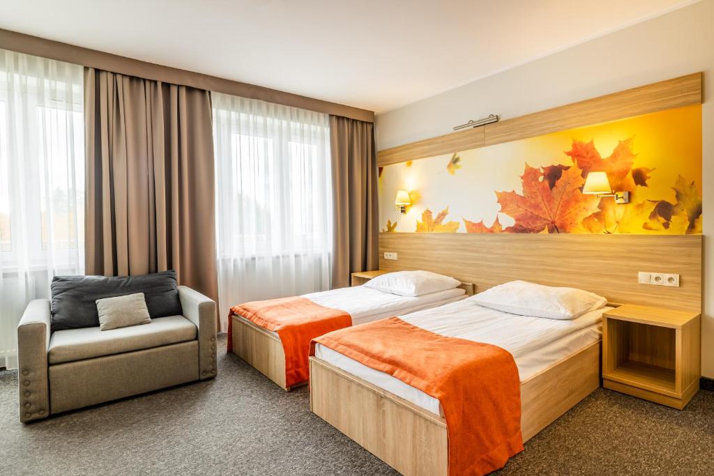 Postel nebo postele na pokoji v ubytování Hotel Leśny