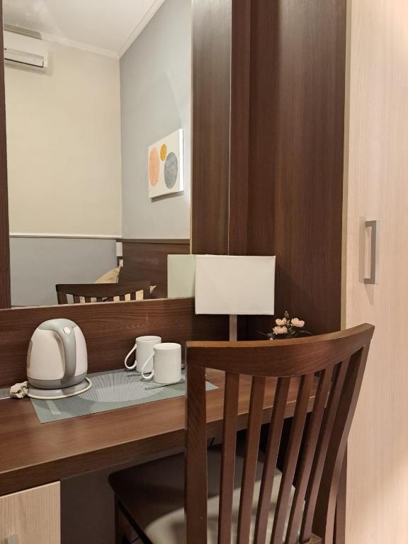 TV a/nebo společenská místnost v ubytování Hotel Leone