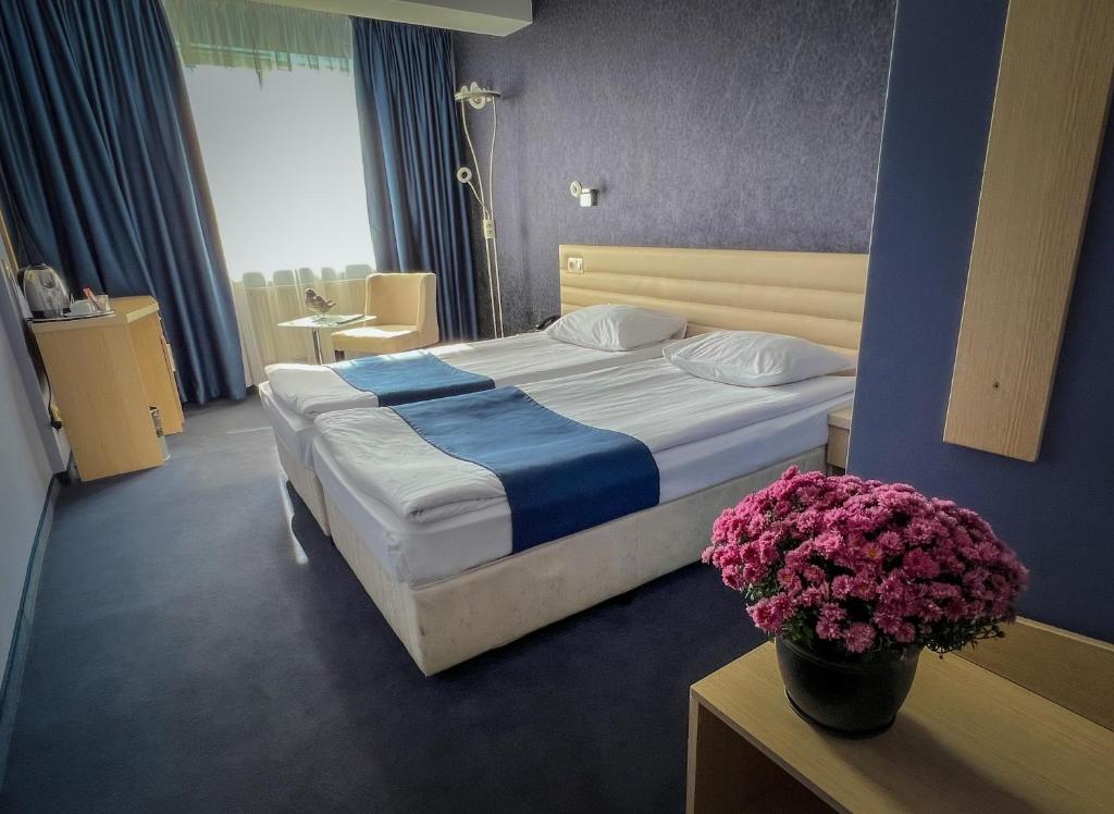 A bed or beds in a room at Hotel Rila