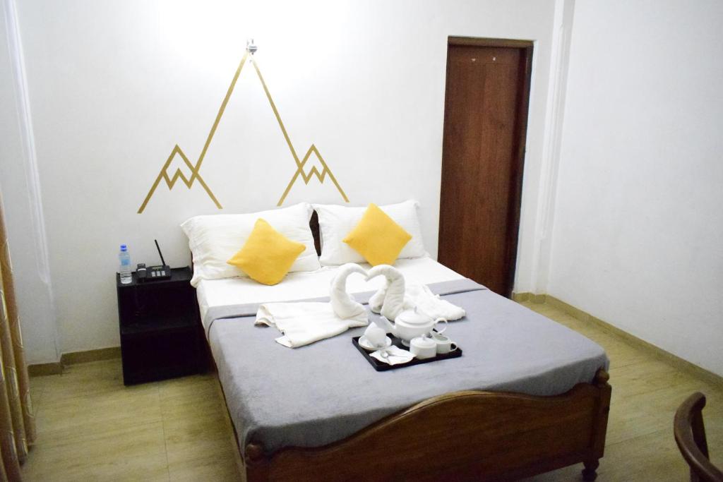 Postel nebo postele na pokoji v ubytování Paradise Inn