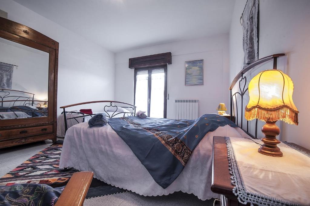 A bed or beds in a room at Passiflora House - Basilicata