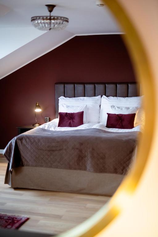 Postel nebo postele na pokoji v ubytování Home Hotel Cardinal